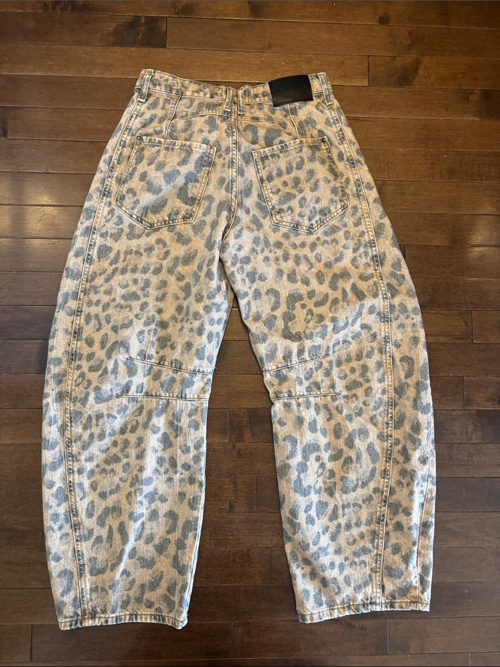 We The Free Leopard Print mid rise barrel Jeans in Light brown and faded black. - Picture 3 of 9